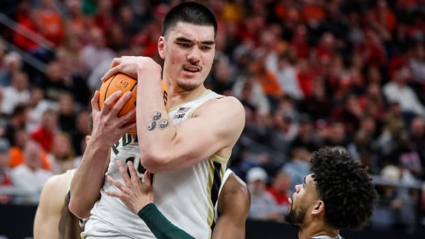 Purdue center Zach Edey (15) grabs a rebound against Michigan State forward Malik Hall (25) during the second half of quarterfinal of Big Ten tournament at Target Center in Minneapolis, Minn. on Friday, March 15, 2024.  
